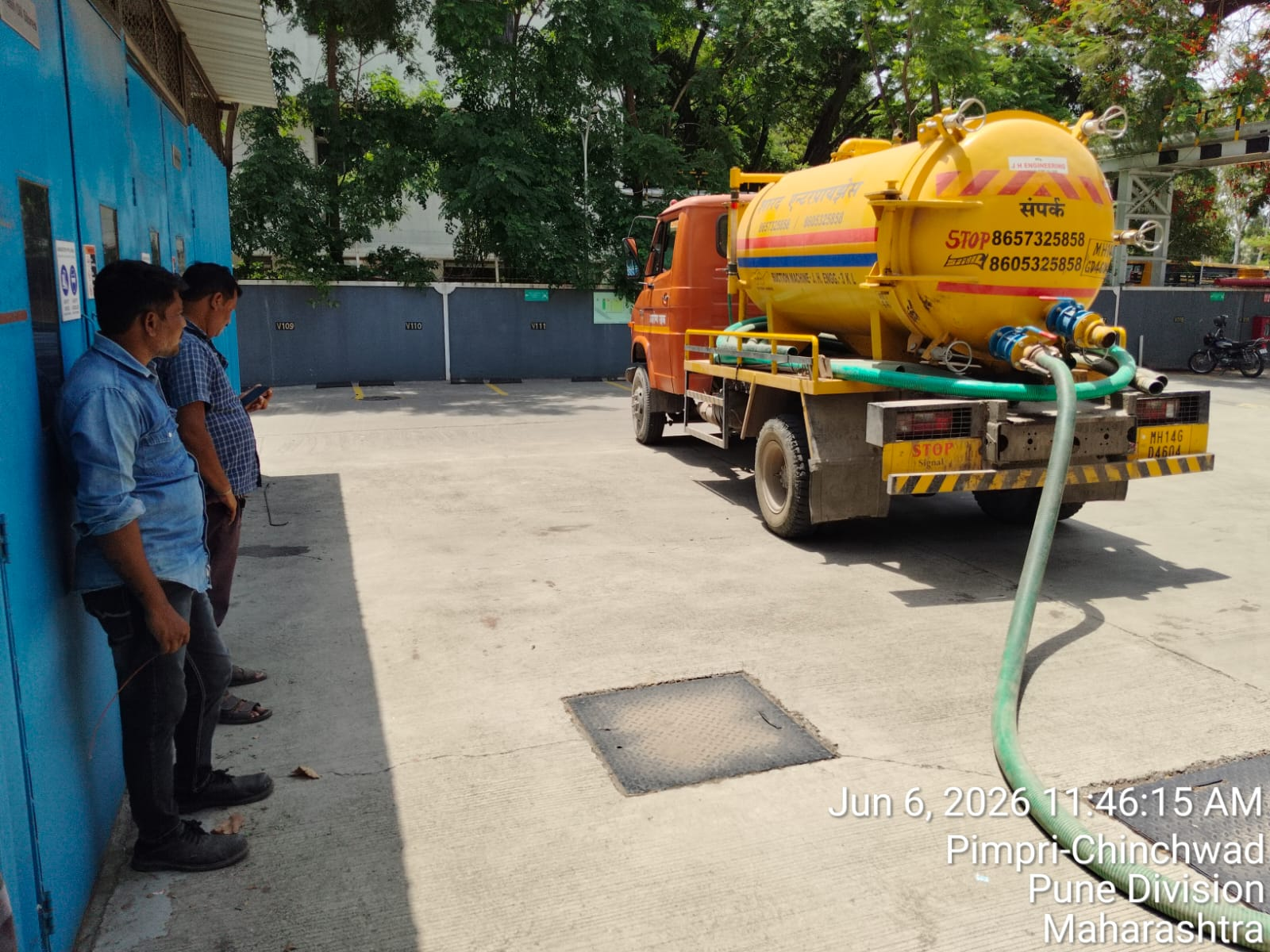 Vacuum tanker and field crew at a service location